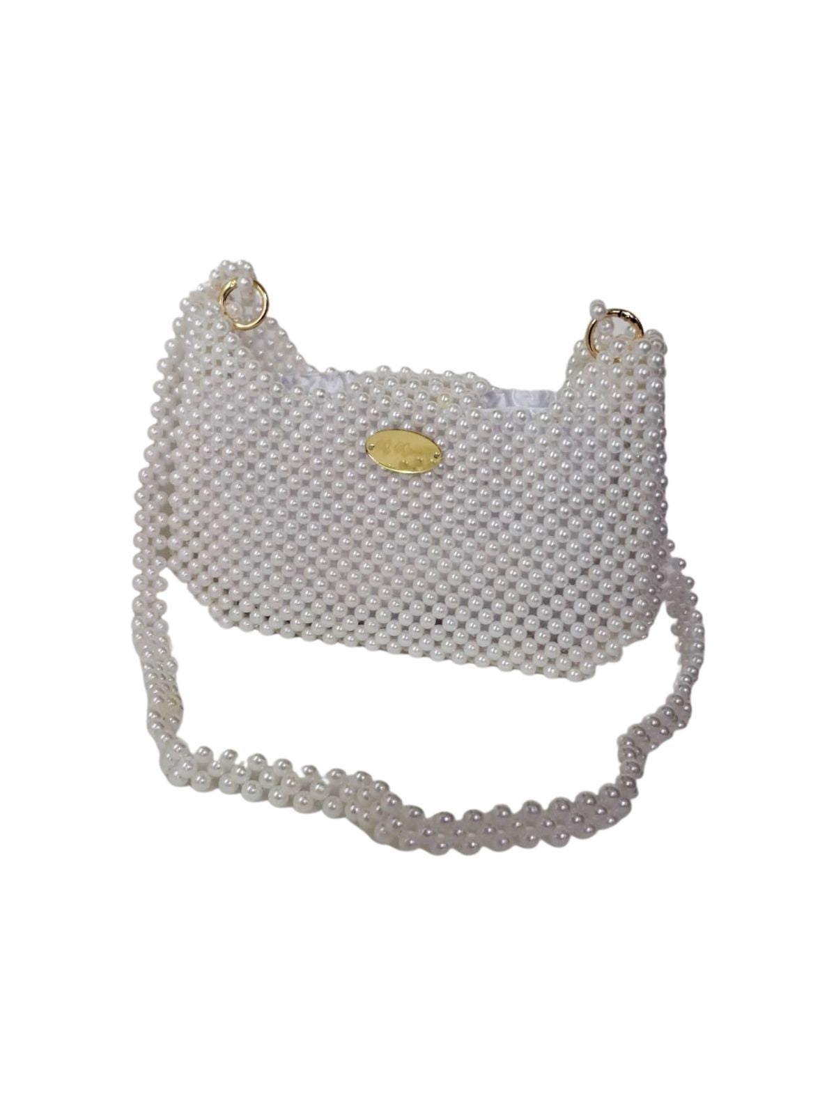 Pearl-handled handbag on a white background
