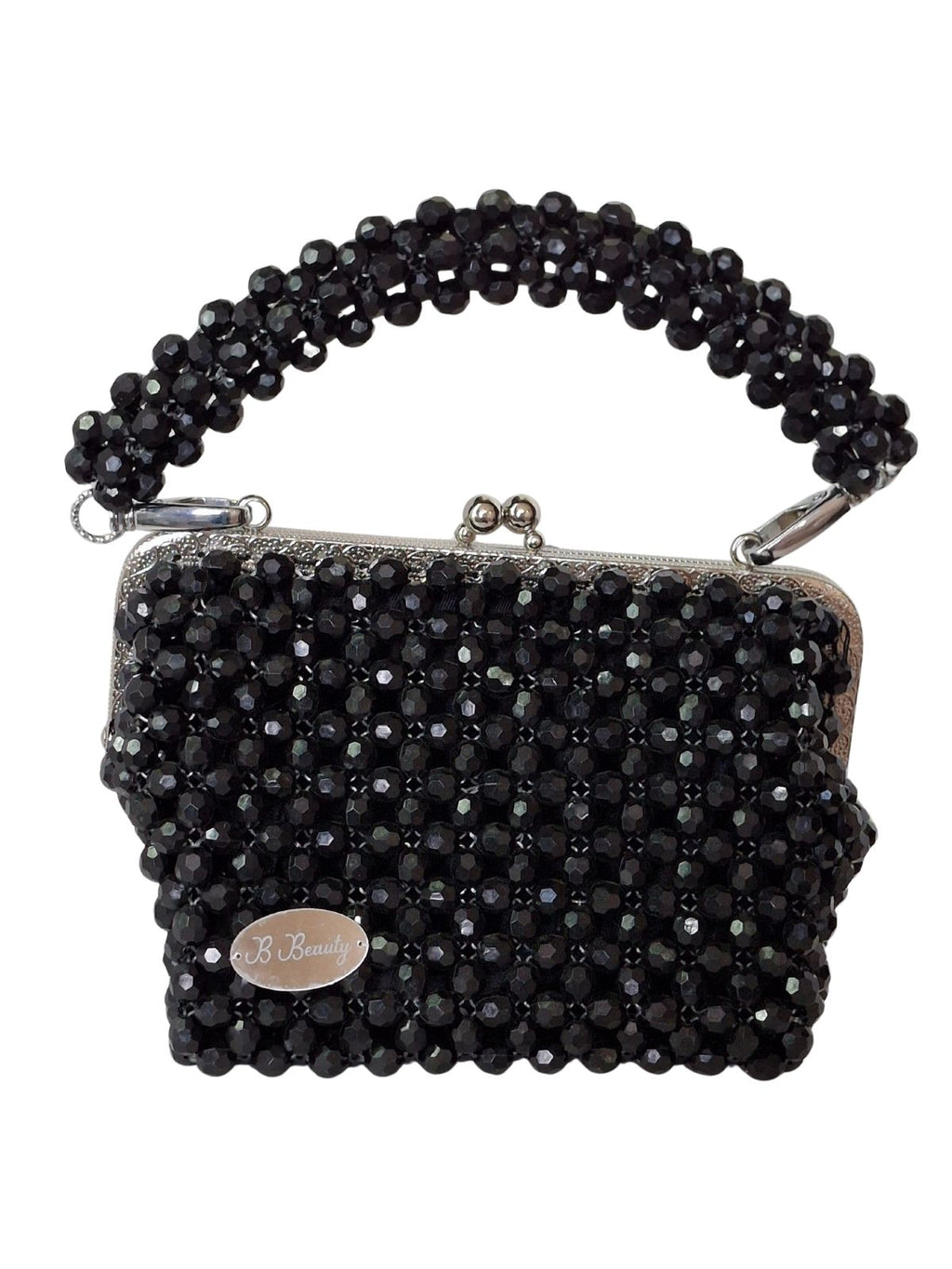 Black beaded handbag with a chain strap on a white background