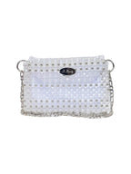 White clutch bag with pearl embellishments on a white background